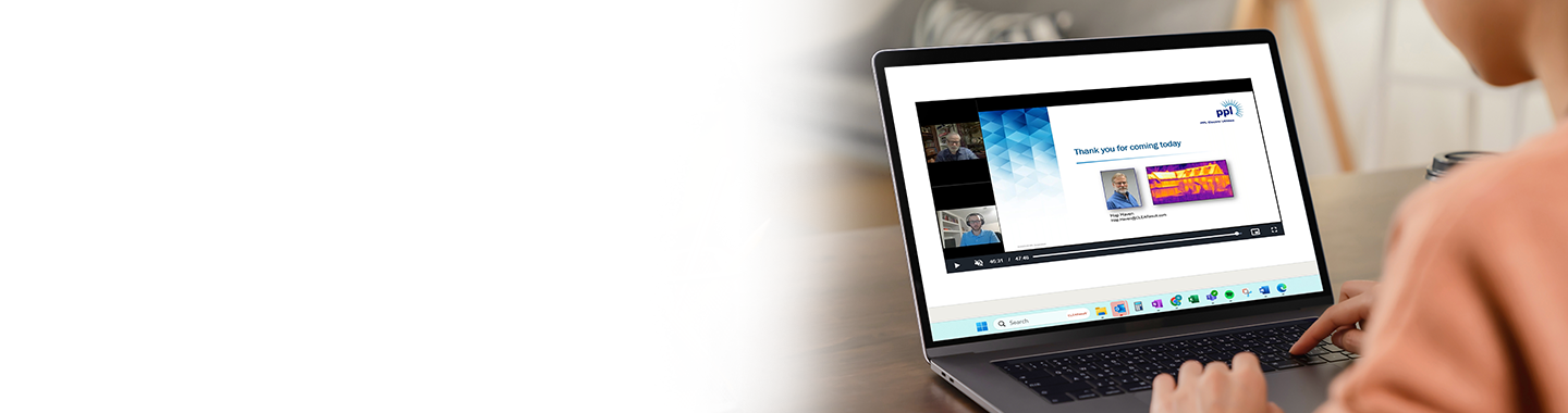 A person using their laptop to watch energy efficiency webinar